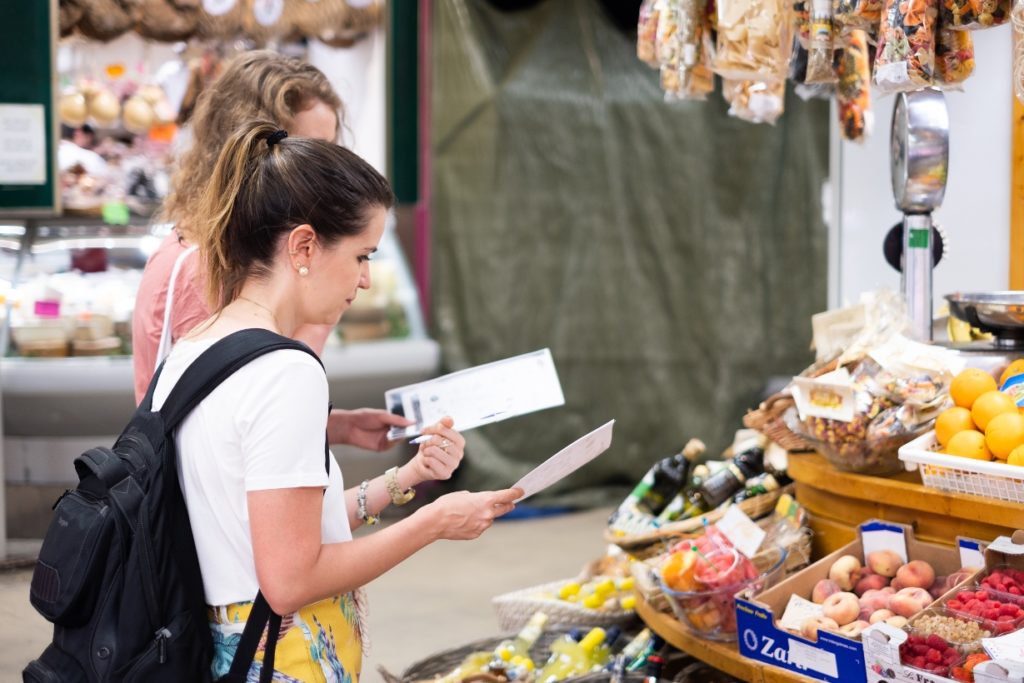 italian language students learning at the market