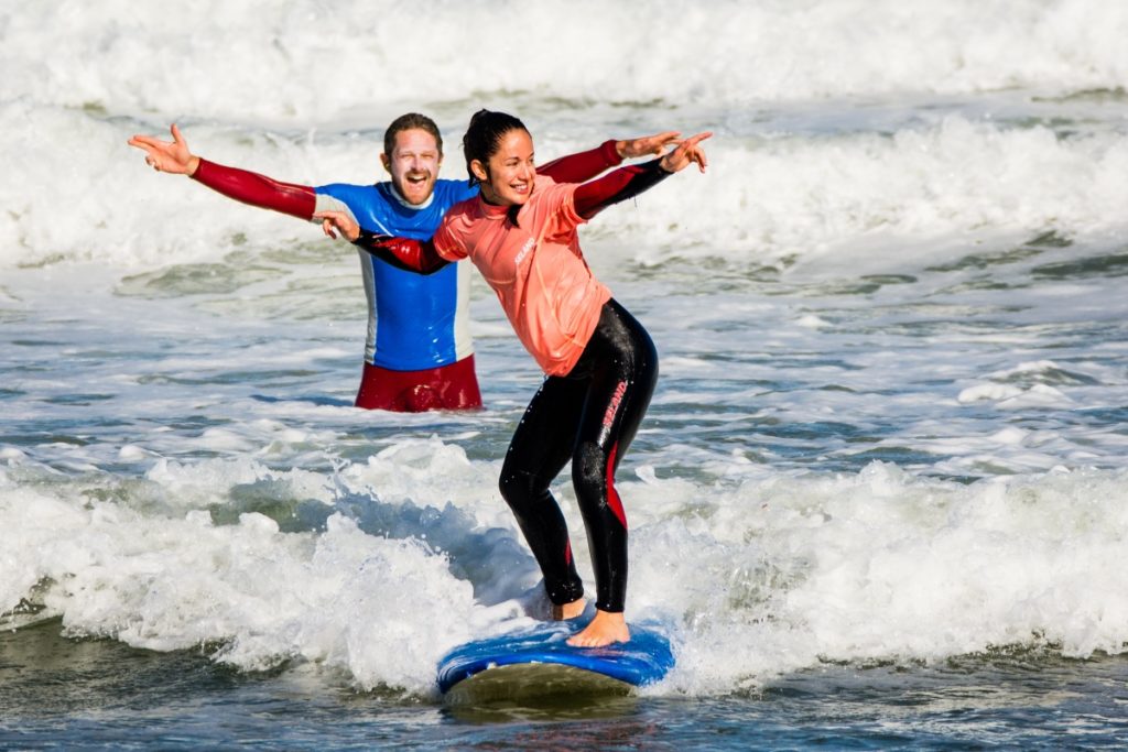 surfer riding first wave