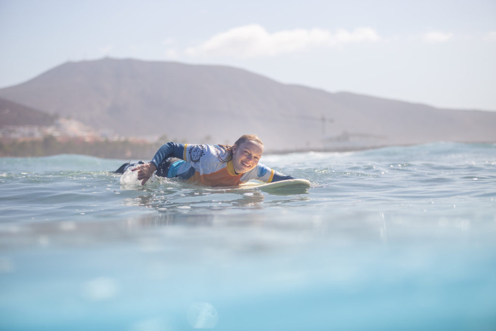 swimming on a surfboard in tenerife