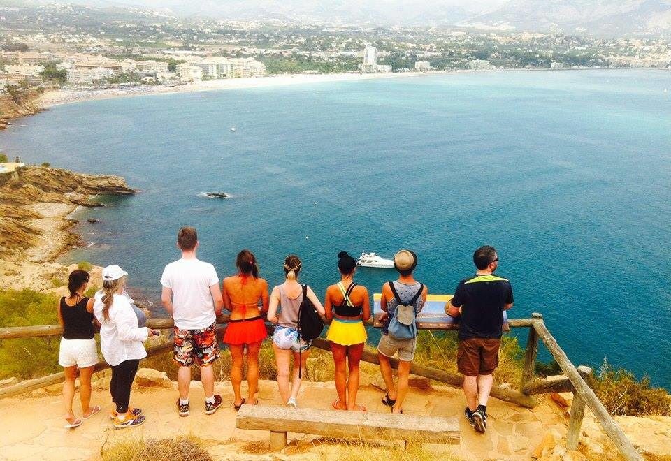 people looking at a view of the sea