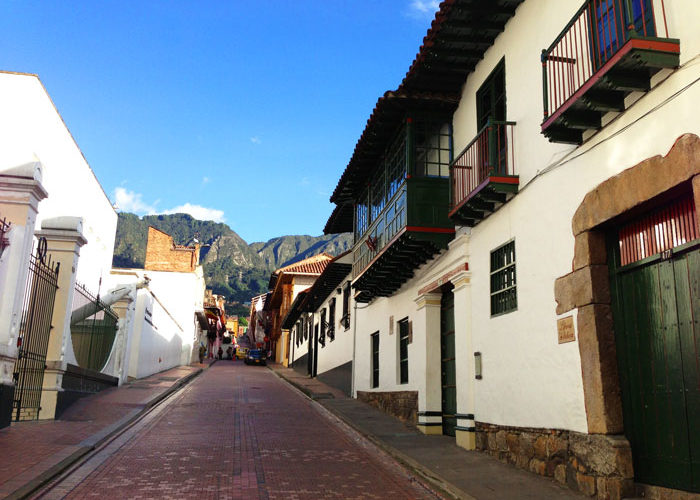 cobbled street lined with old buildings 