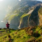 man hiking along coast near Donegal