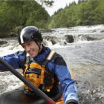 male kayaker in scotland river