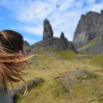 woman looks at mountains in isle of skye