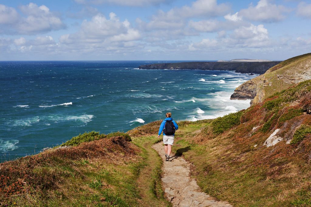 person walking along coastal path