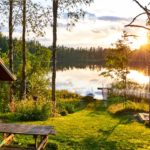 wood hut by the lake in the summer