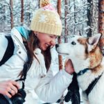 woman traveller and husky dog