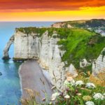 orange sunset over white cliffs of normandy france