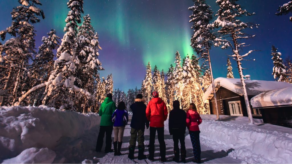 small group watching northern lights in iceland