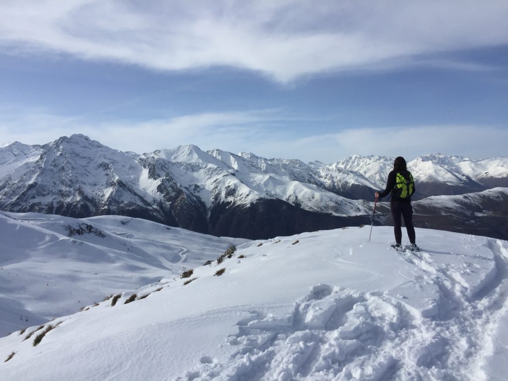 person standing on a mountain in the french pyrenees