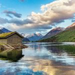 small house by a lake in norway