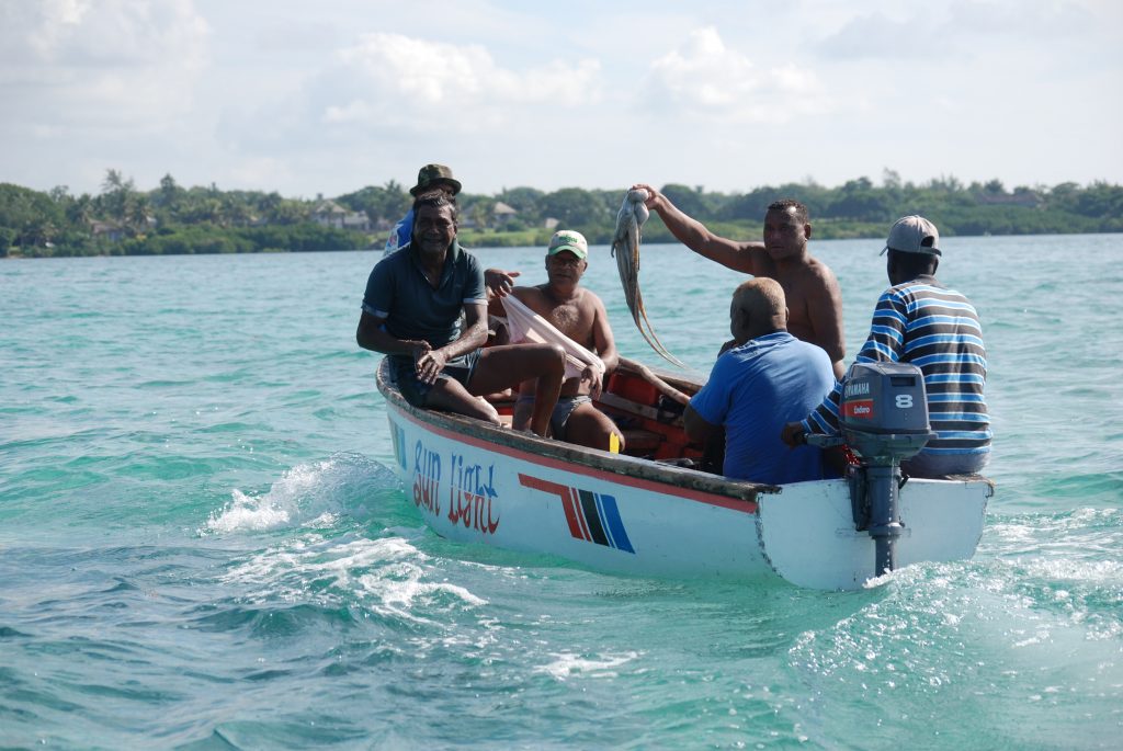 fisherman on a boat in mauritius