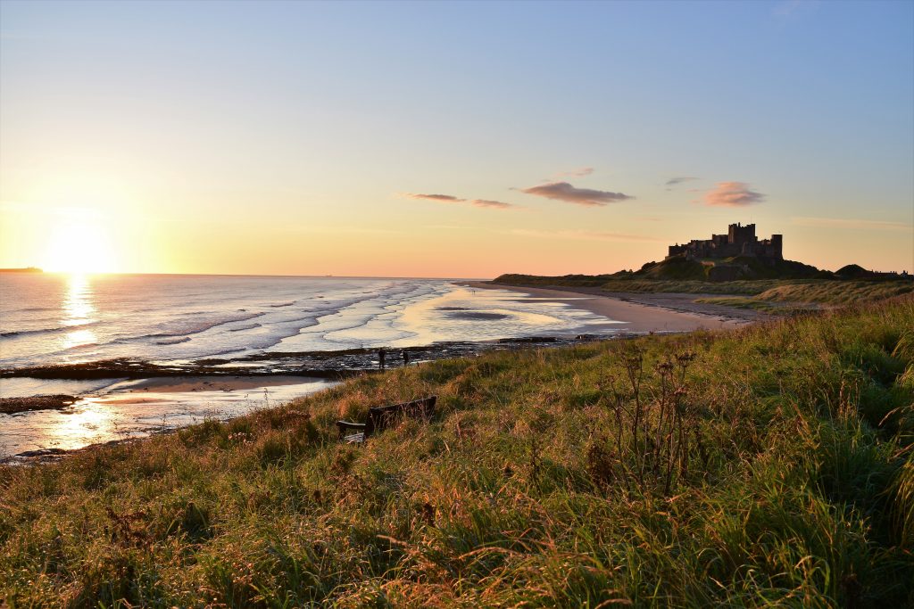 beach and castle in uk surf destination northumberland