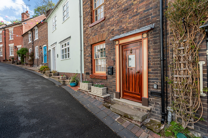 road view of quirky house