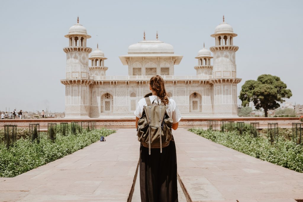 solo traveller in front of a temple