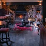 dog by a fire in a pub in somerset