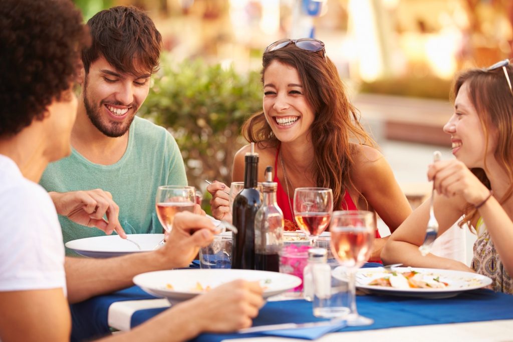 people eating and drinking in corfu