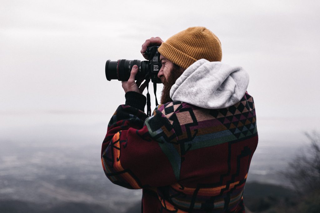 man taking a photo