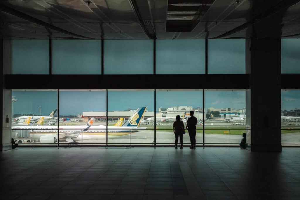 two people in a quiet airport